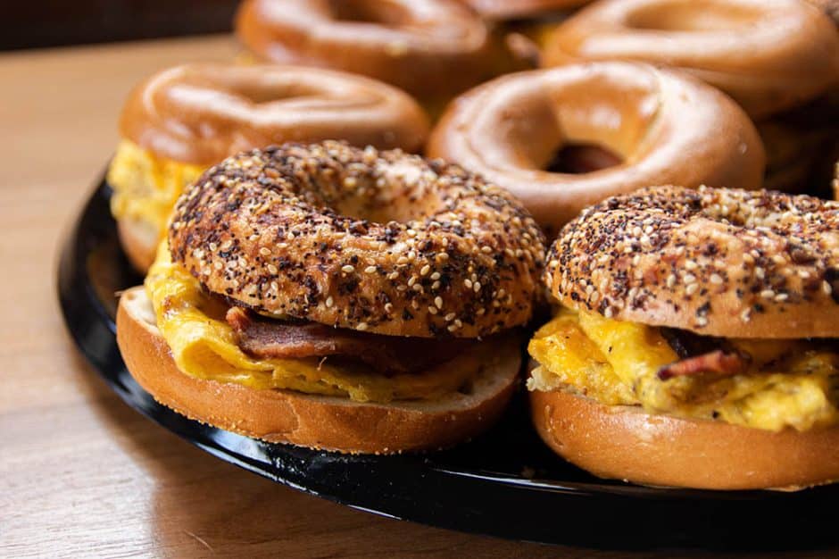 tray of bacon egg and cheese bagel sandwiches for small format catering