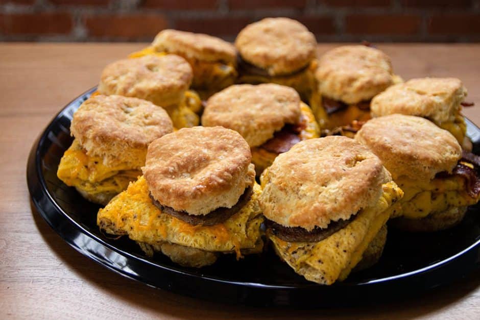 platter of frothy monkey biscuit sandwiches with egg, sausage and cheese. 